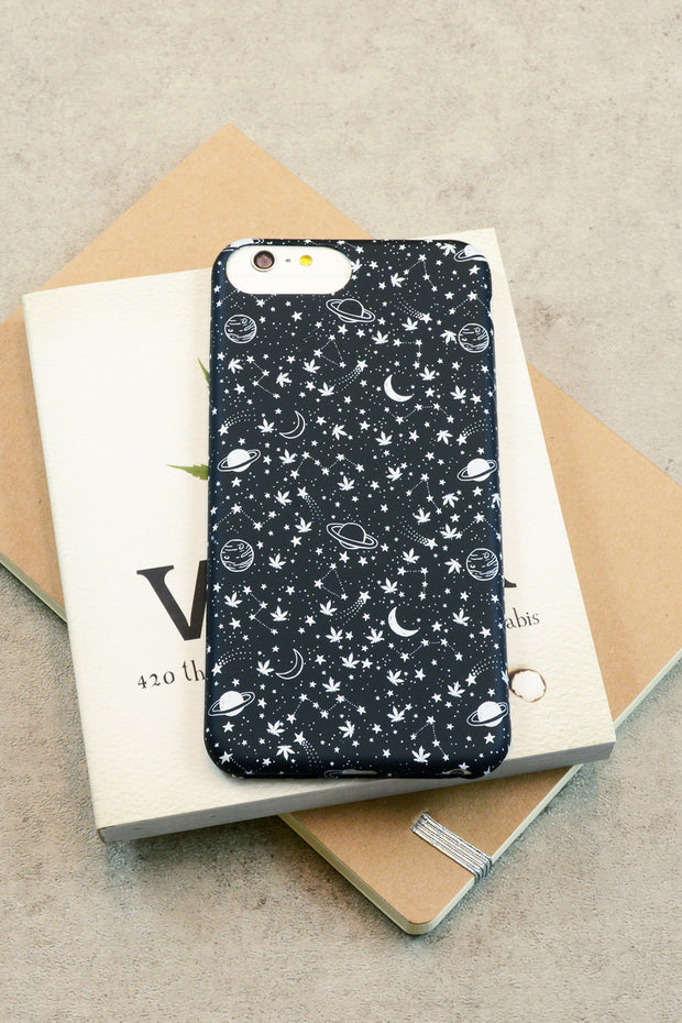 Lightly Toasted Celestial Print iPhone Case sitting on top of books 