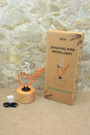 Lightly Toasted Pipe Neon Light next to box 