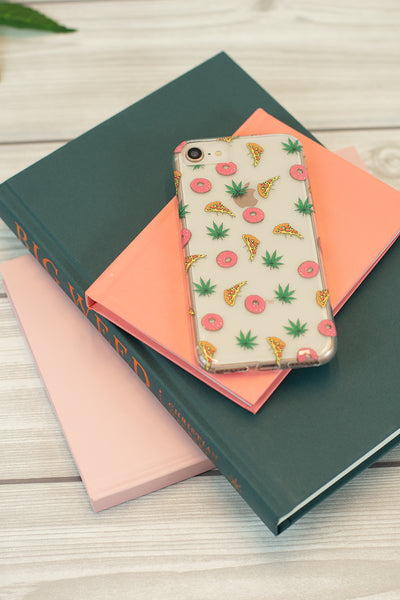 Lightly Toasted Pizza Print iPhone Case on top of books